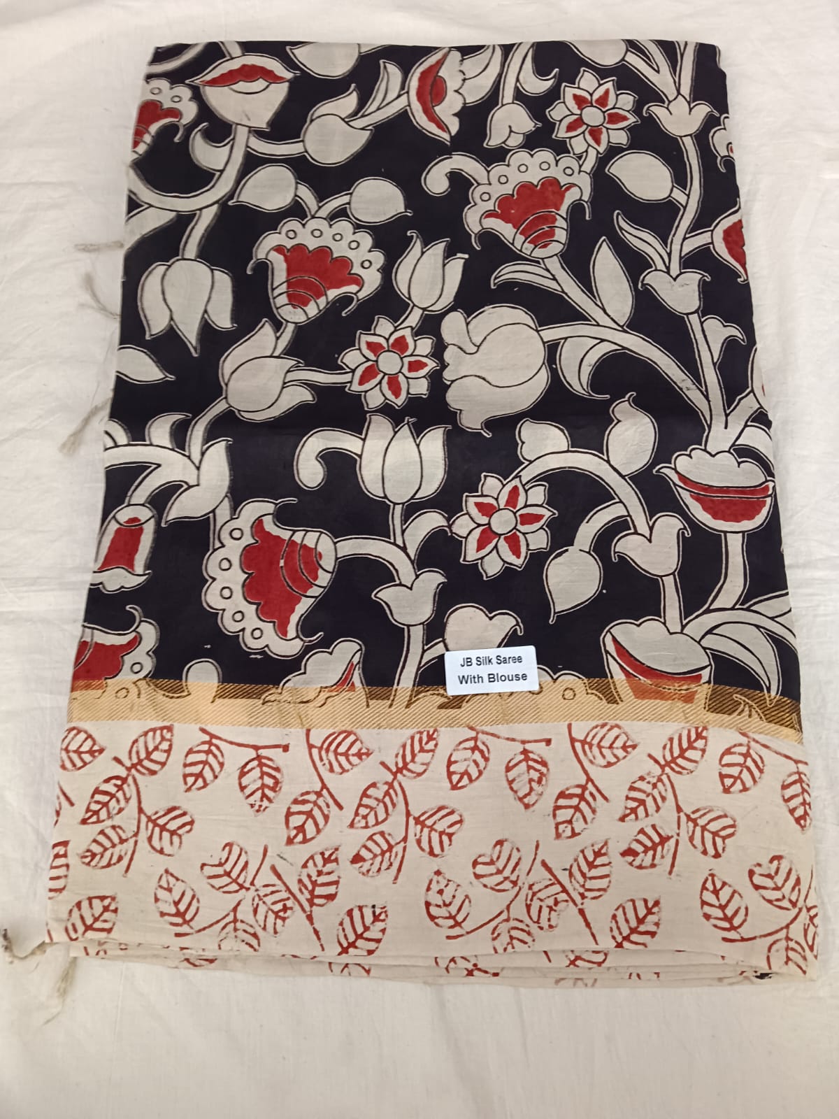 Midnight Bloom JB Silk Saree – Black Floral with Red Leaf Pallu